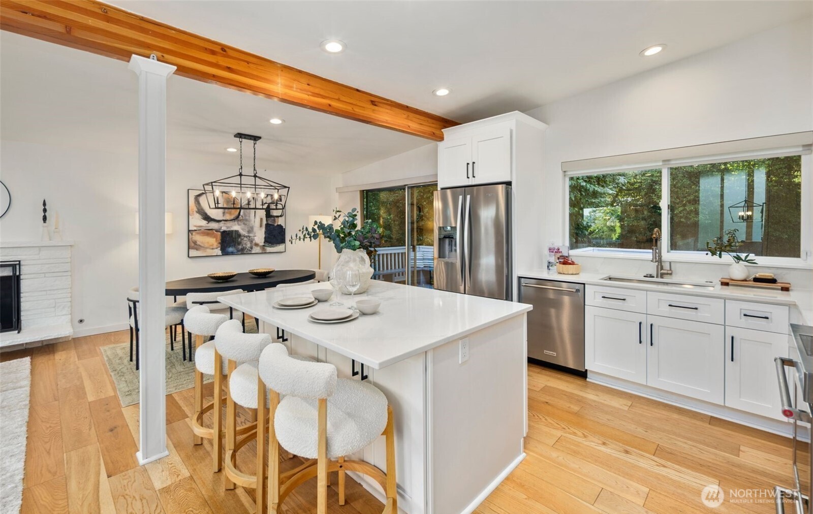 201 165th Avenue Northeast Bellevue, WA 98008 - Photo 5 of 13 a kitchen with stainless steel appliances kitchen island granite countertop a sink and cabinets