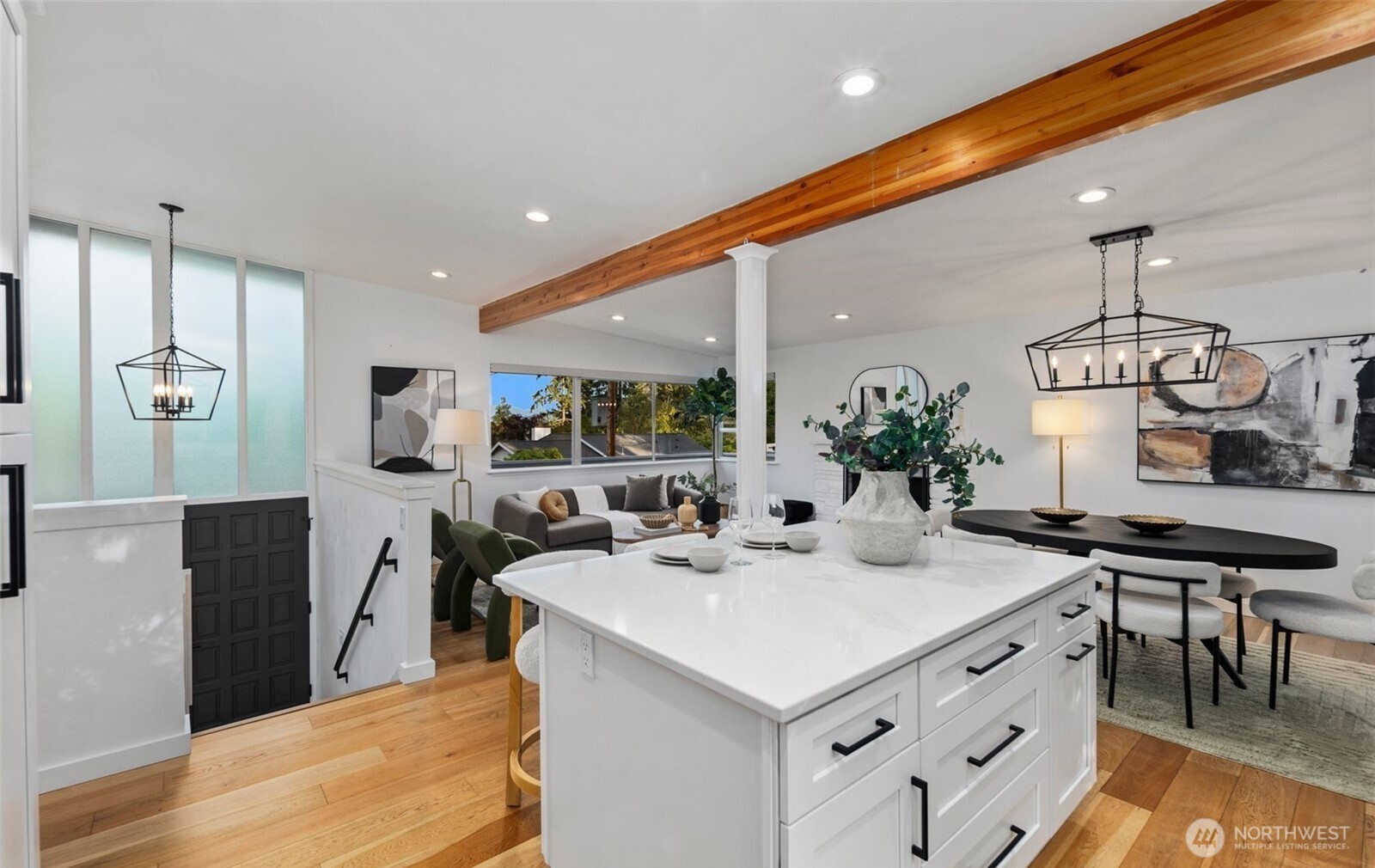 201 165th Avenue Northeast Bellevue, WA 98008 - Photo 7 of 13 a kitchen with stainless steel appliances kitchen island granite countertop a sink a stove and a refrigerator