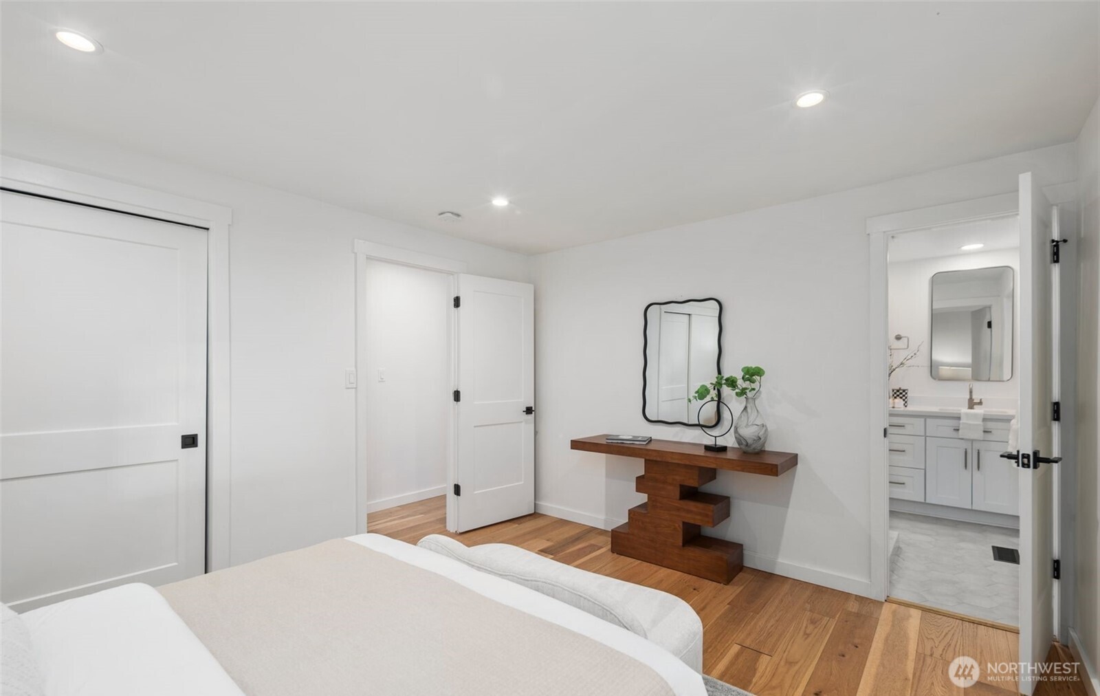 201 165th Avenue Northeast Bellevue, WA 98008 - Photo 8 of 13 a bedroom with a bed and a dresser