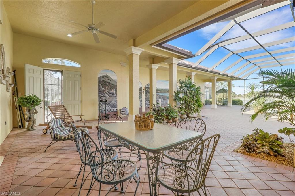 435 Terracina Way Naples, FL 34119 - Photo 12 of 50 a dining room with furniture and wooden floor
