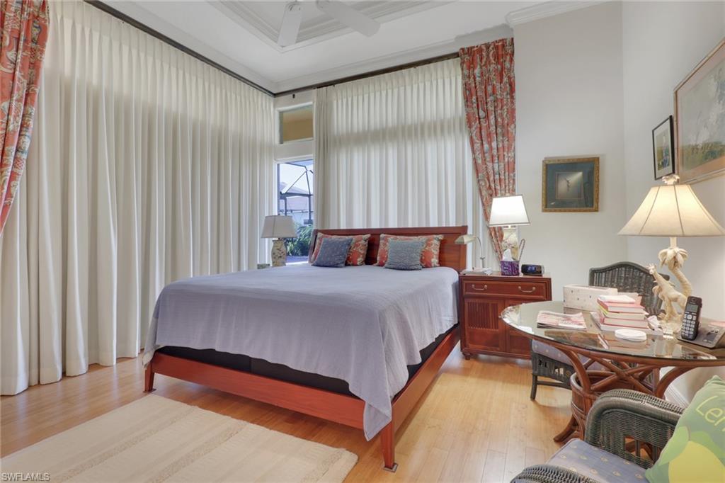435 Terracina Way Naples, FL 34119 - Photo 24 of 50 a bedroom with a bed and window