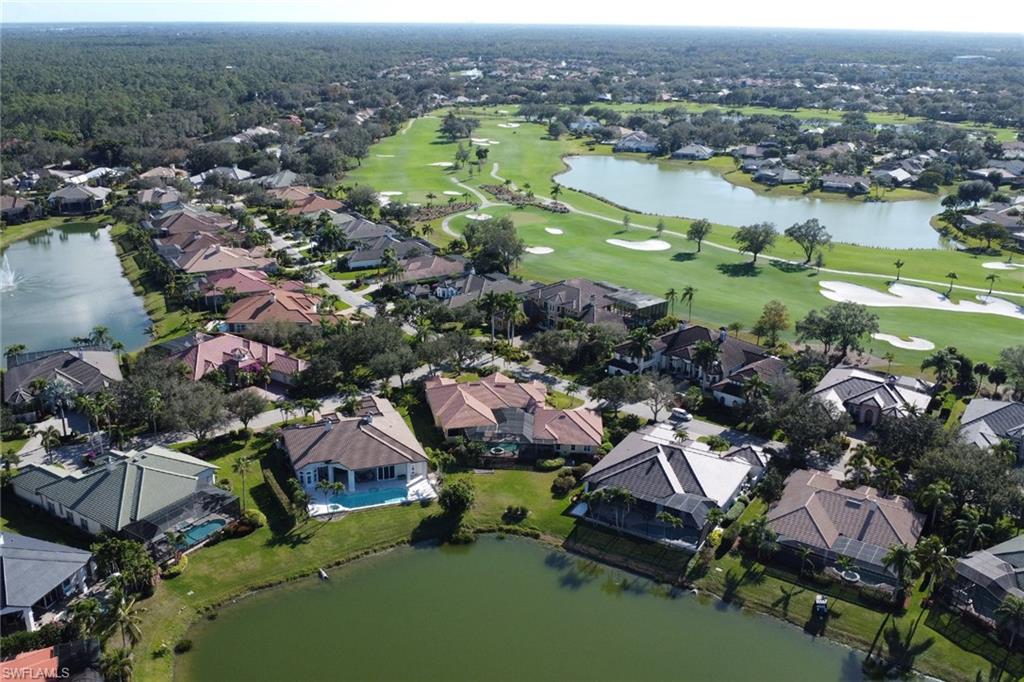 435 Terracina Way Naples, FL 34119 - Photo 36 of 50 an aerial view of residential houses with outdoor space and lake view