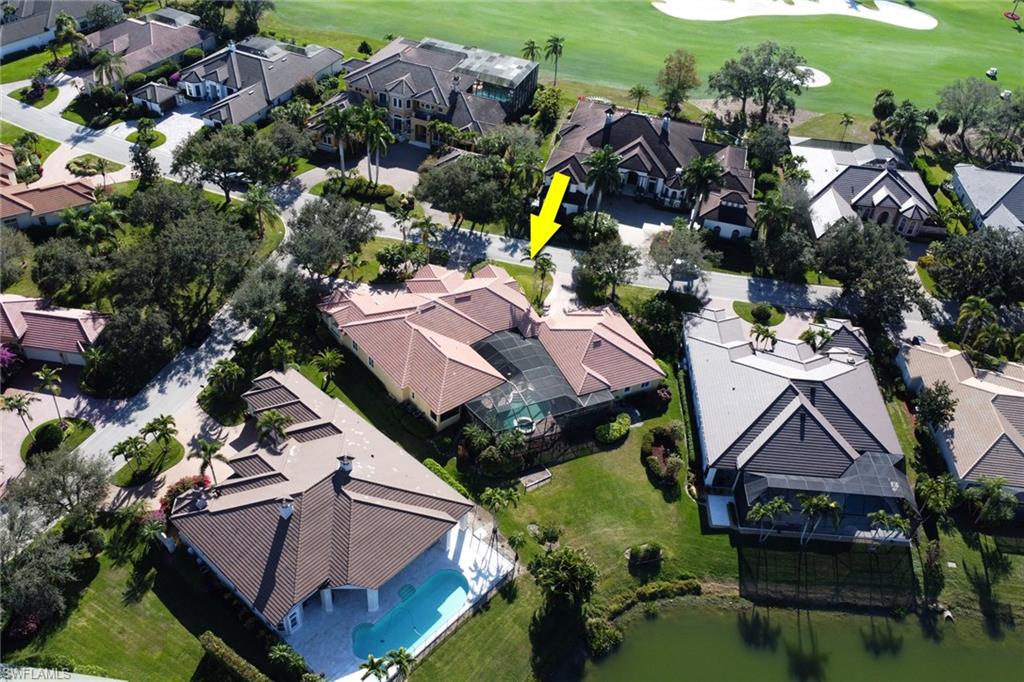 435 Terracina Way Naples, FL 34119 - Photo 37 of 50 an aerial view of houses with yard