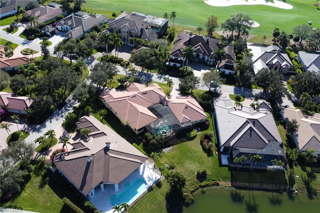 435 Terracina Way Naples, FL 34119 - Photo 38 of 50 an aerial view of houses with yard