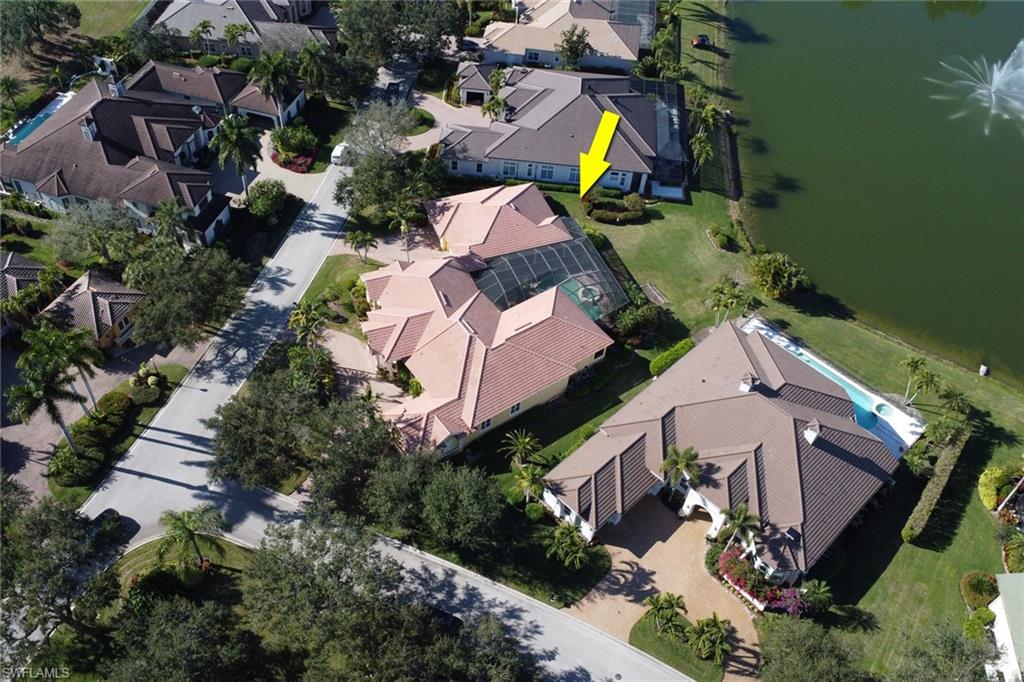 435 Terracina Way Naples, FL 34119 - Photo 40 of 50 an aerial view of a house with a garden