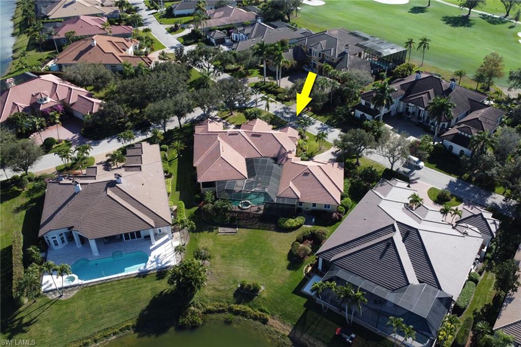 435 Terracina Way Naples, FL 34119 - Photo 41 of 50 an aerial view of house with yard swimming pool and outdoor seating