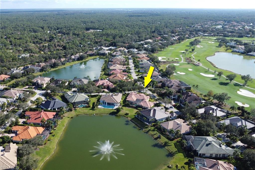 435 Terracina Way Naples, FL 34119 - Photo 43 of 50 an aerial view of residential houses with outdoor space and lake view