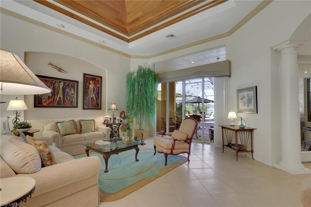 435 Terracina Way Naples, FL 34119 - Photo 7 of 50 a living room with furniture and a large window