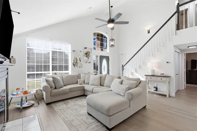 a living room with furniture and a flat screen tv