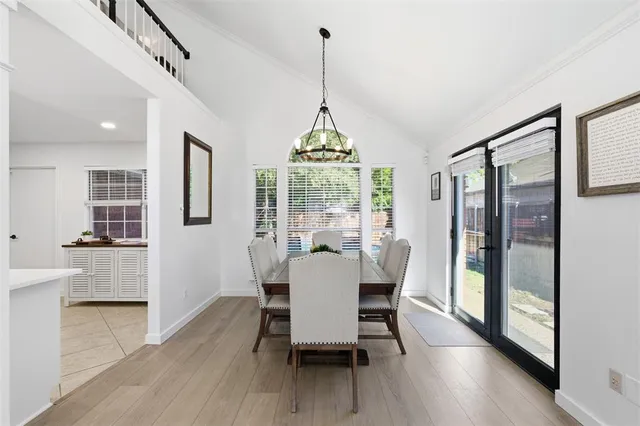 a dining room with furniture window wooden floor
