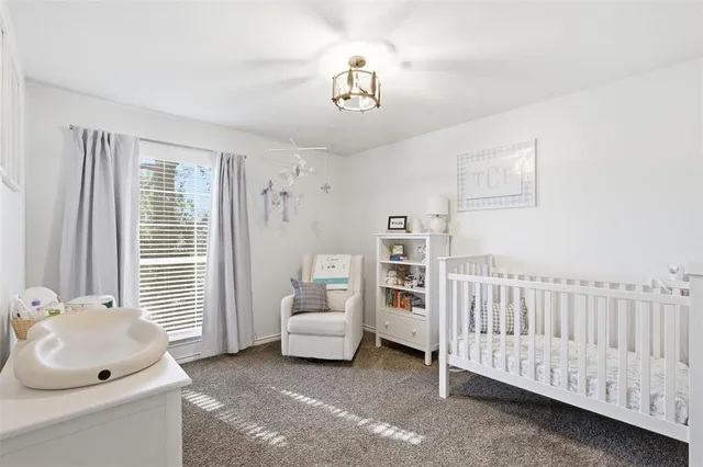 a bedroom with furniture and white walls