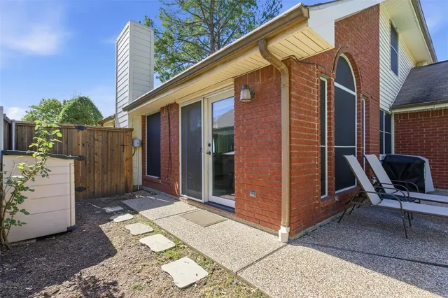 a view of backyard with wheel chair and potted plants