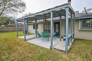a view of a house with a bath tub and a yard