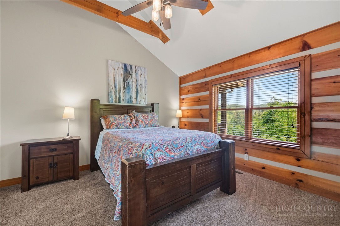 850 River Ridge Road Boone, NC 28607 - Photo 11 of 26 a bed sitting in a bedroom next to a window