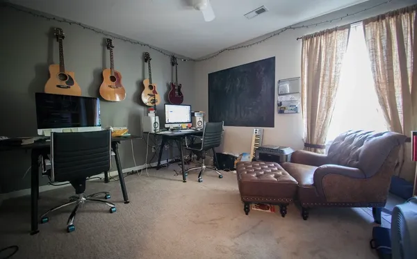 a living room with furniture and a window
