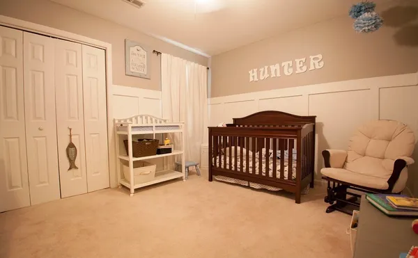 a view of a bedroom with furniture and staircase