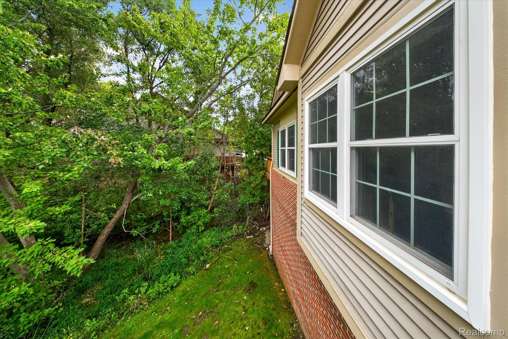 30900 Jasper Ridge Novi, MI 48377 - Photo 36 of 45 View of side- private with mature trees