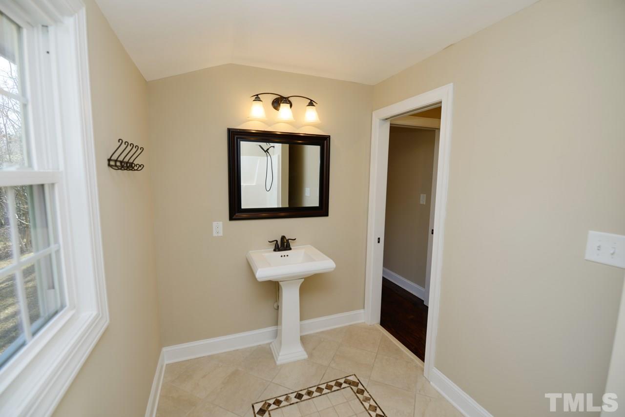 8300 Pinecrest Road Raleigh, NC 27613 - Photo 6 of 12 a view of a sink and a mirror