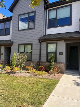 a view of house with yard
