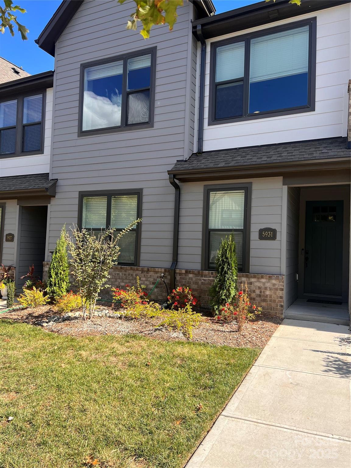 a view of house with yard