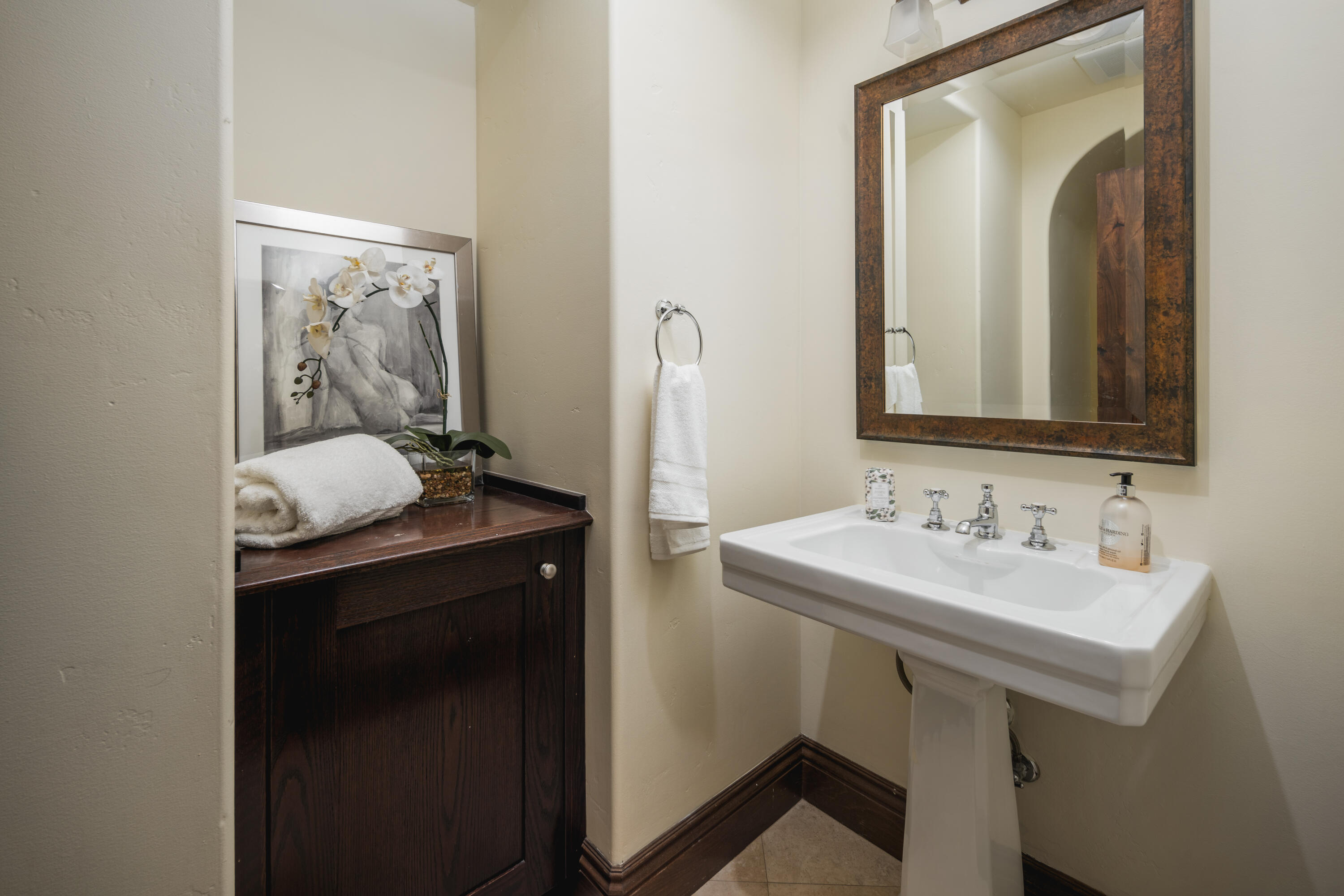 267 Elderberry Drive Goleta, CA 93117 - Photo 13 of 28 a bathroom with a sink and a mirror