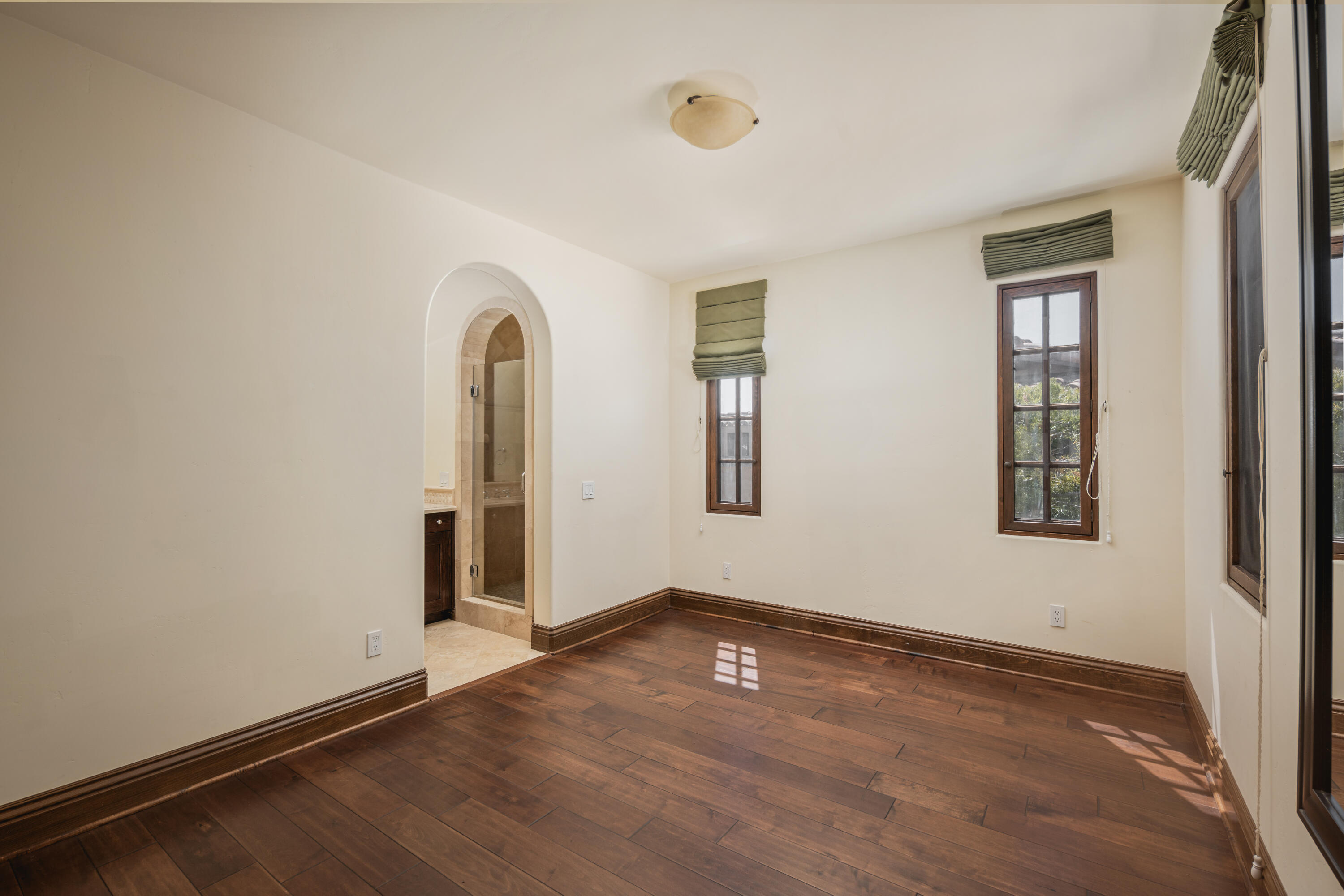 267 Elderberry Drive Goleta, CA 93117 - Photo 21 of 28 an empty room with wooden floor and windows