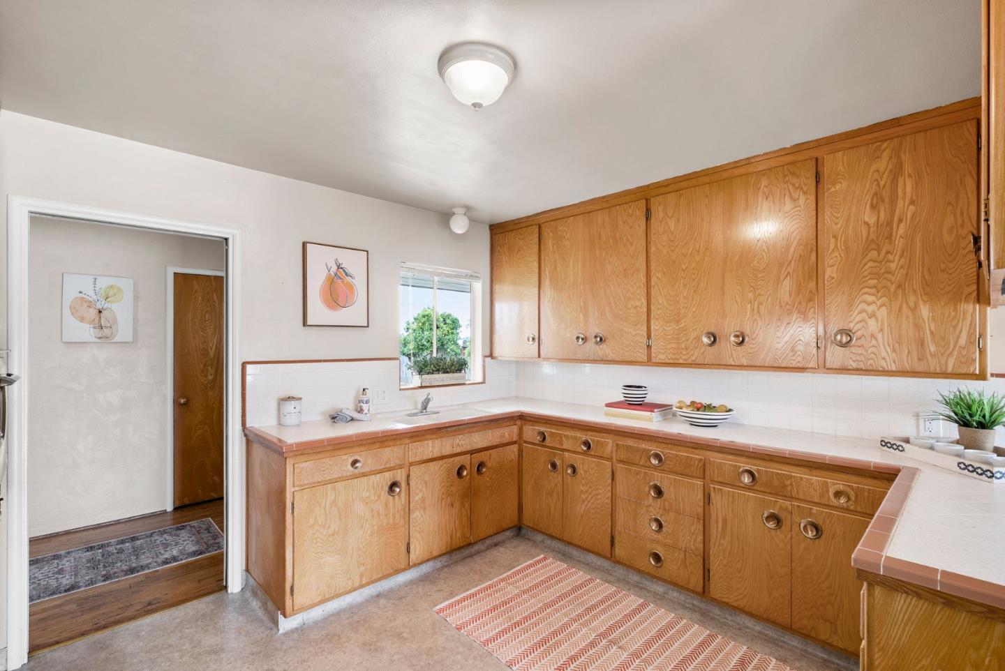 345 Green Valley Road Watsonville, CA 95076 - Photo 20 of 44 a kitchen with a sink cabinets and window