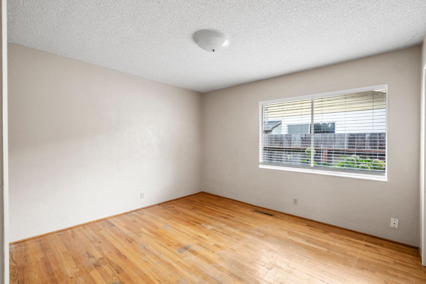 345 Green Valley Road Watsonville, CA 95076 - Photo 22 of 44 a view of an empty room with a window