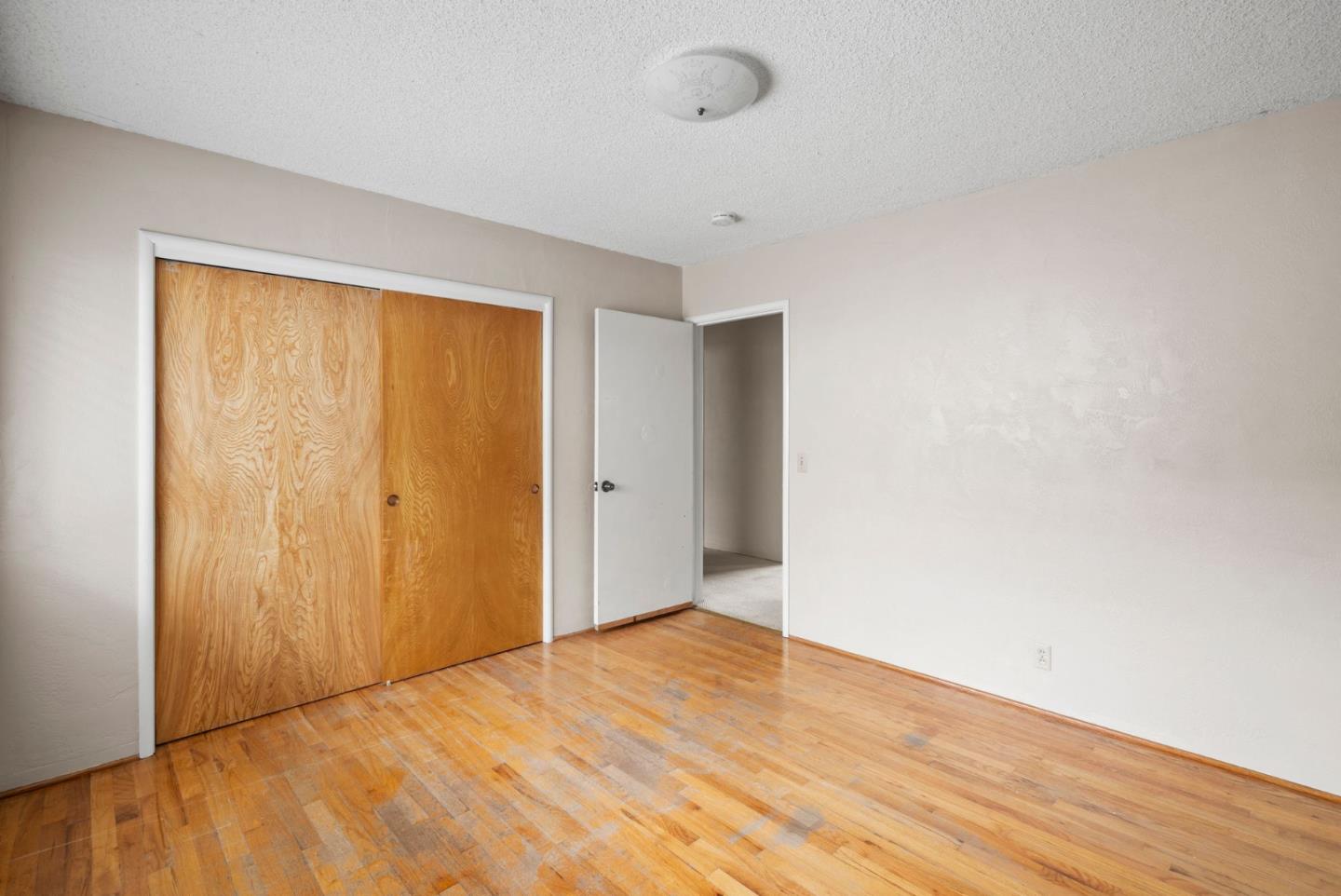 345 Green Valley Road Watsonville, CA 95076 - Photo 23 of 44 a view of an empty room and wooden floor
