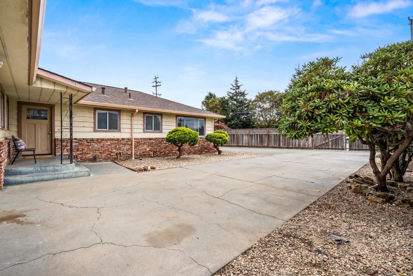 345 Green Valley Road Watsonville, CA 95076 - Photo 3 of 44 a front view of a house with a yard