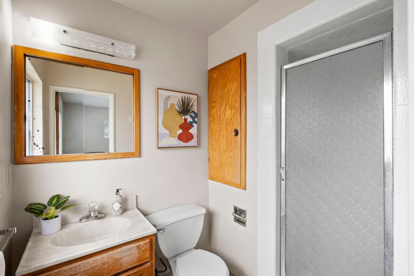 345 Green Valley Road Watsonville, CA 95076 - Photo 33 of 44 a bathroom with a toilet sink and mirror