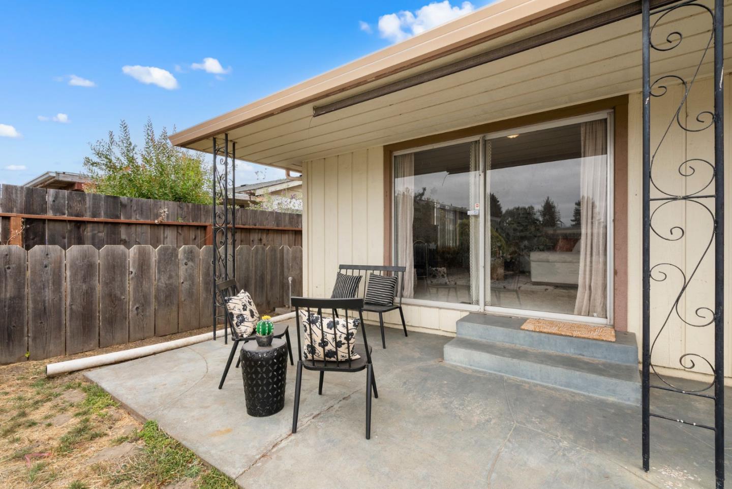 345 Green Valley Road Watsonville, CA 95076 - Photo 44 of 44 a patio with table and chairs and potted plants