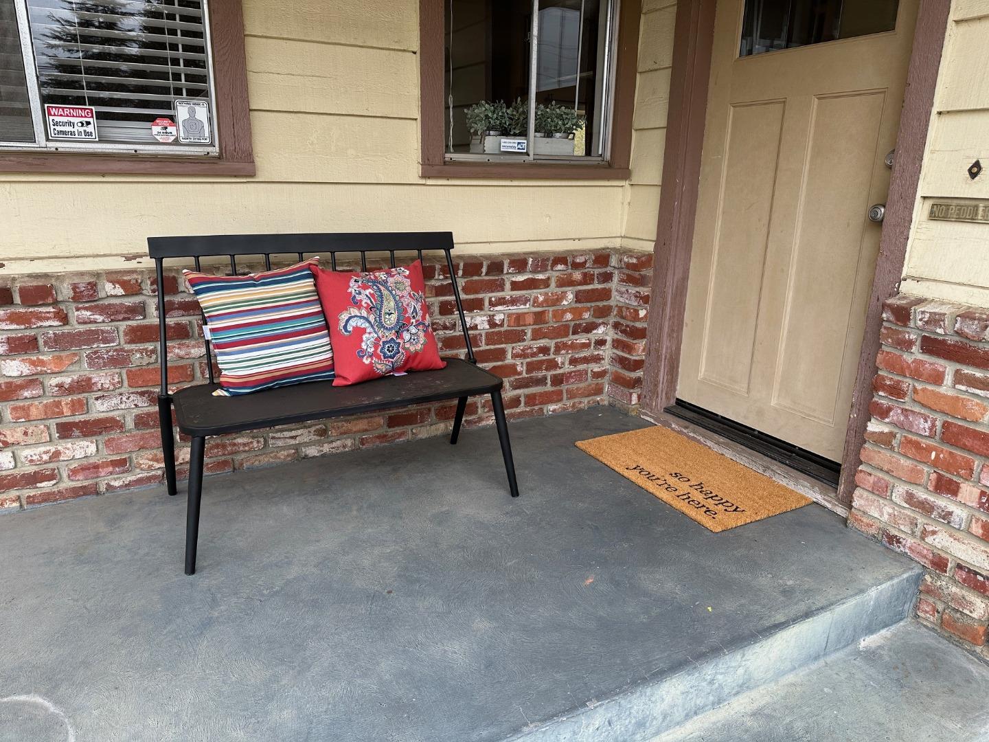 345 Green Valley Road Watsonville, CA 95076 - Photo 5 of 44 a bench sitting in front of a building
