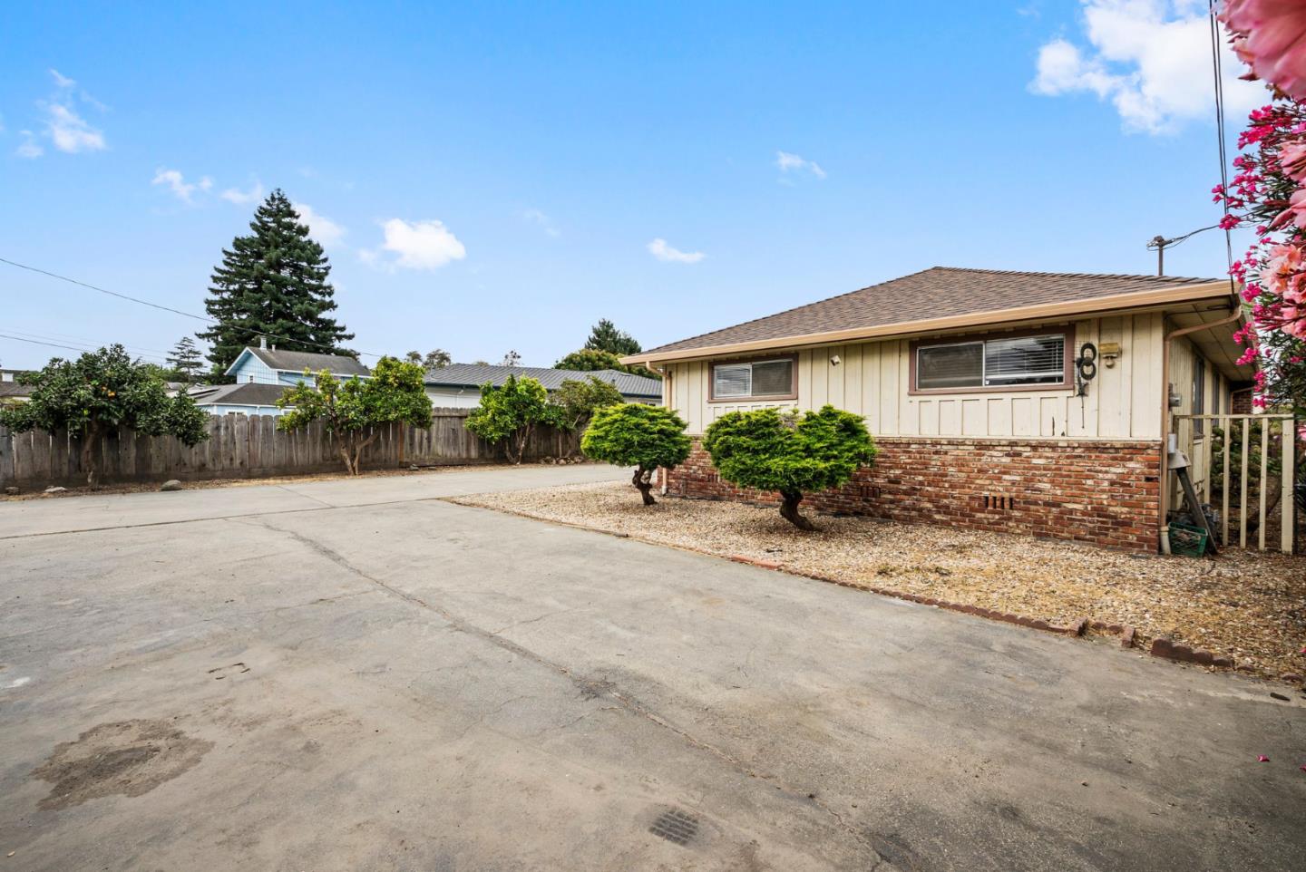 345 Green Valley Road Watsonville, CA 95076 - Photo 6 of 44 a front view of a house with a yard and a garage