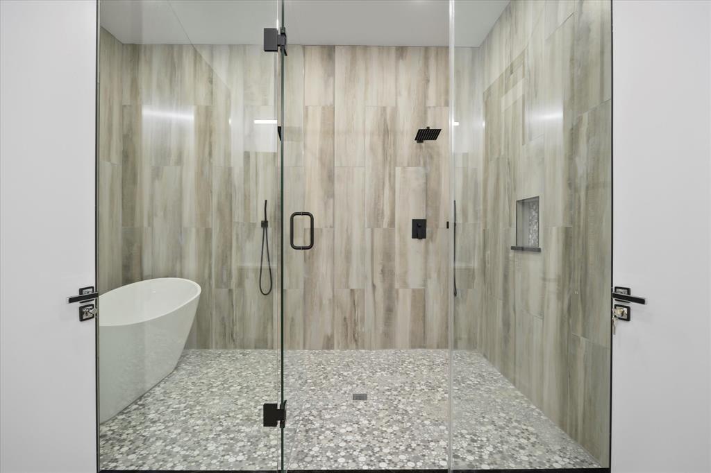 2811 Rodeo Drive Quinlan, TX 75474 - Photo 12 of 35 Bathroom with a stall shower and a freestanding tub