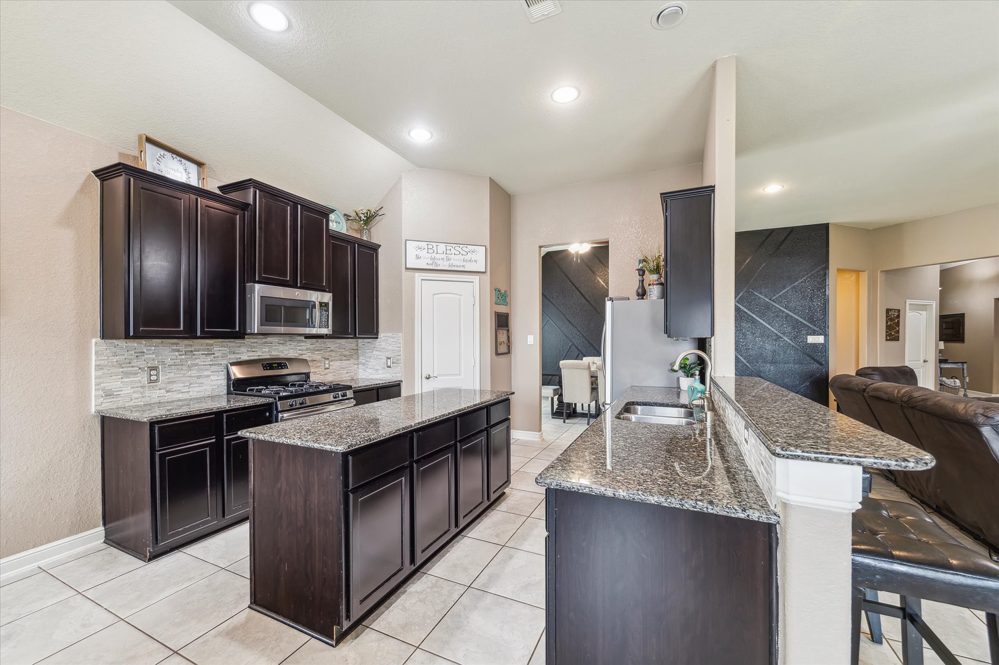 4914 Mountain Maple Trail Rosenberg, TX 77471 - Photo 11 of 23 Fantastic kitchen with walk in pantry, large island, breakfast bar, plentiful of cabinets, and a great color scheme!