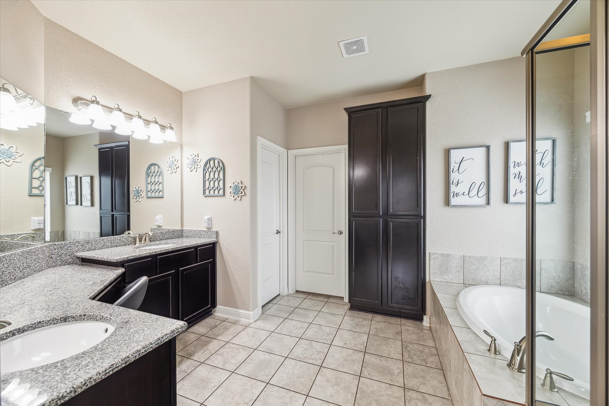 4914 Mountain Maple Trail Rosenberg, TX 77471 - Photo 15 of 23 Primary bathroom with walk in shower, soaking tub, double sinks, vanity, cabinetry for storage and walk in closet.