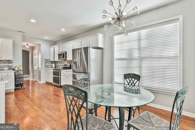 a bedroom with a bed and glass windows