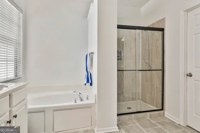 a view of a livingroom with a ceiling fan and couch