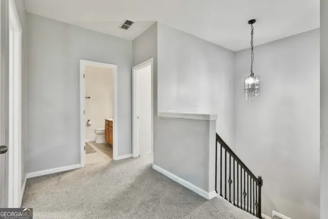 a bathroom with a double vanity sink toilet and shower