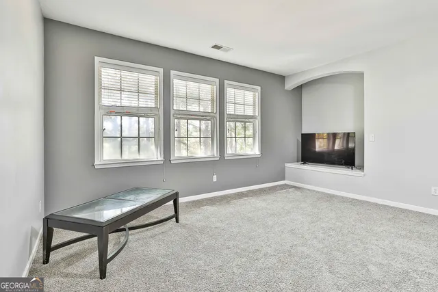 a view of balcony with wooden floor and fence