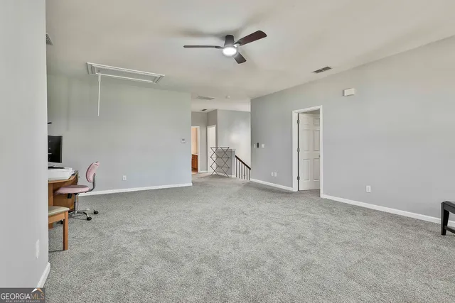 a view of a balcony with a barbeque