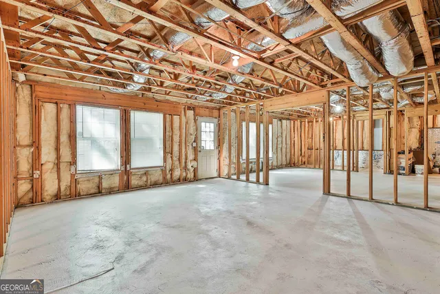 a view of a lake with houses in the back