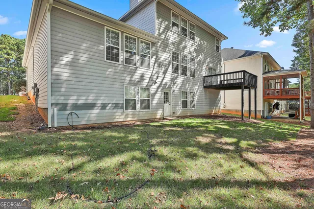 a view of a park with iron fence