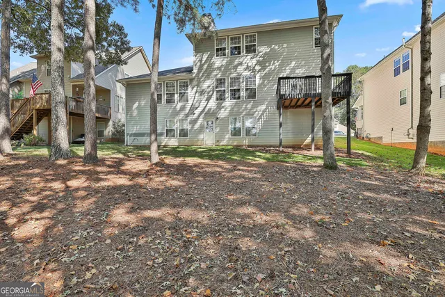 a street sign on a sidewalk next to a road