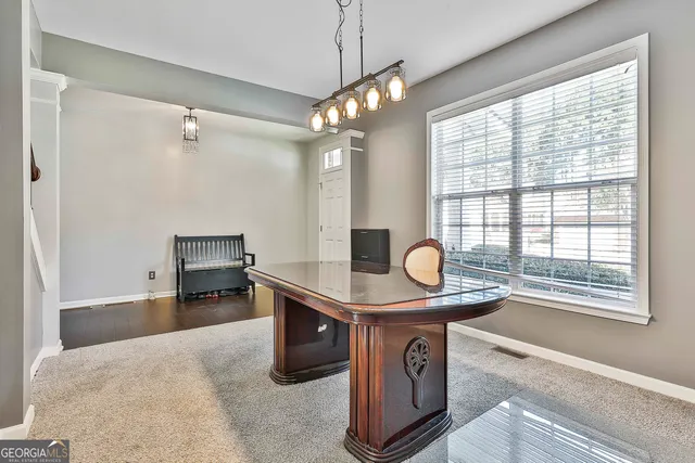 a living room with furniture fireplace and a window