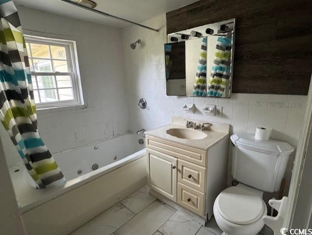 15 Mango Street Andrews, SC 29510 - Photo 11 of 26 Bathroom with a combined bath / shower with jetted tub, vanity, tile walls, and light marble finish floors