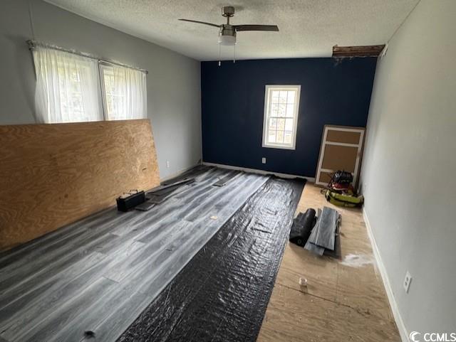15 Mango Street Andrews, SC 29510 - Photo 14 of 26 Unfurnished bedroom with a textured ceiling and a ceiling fan