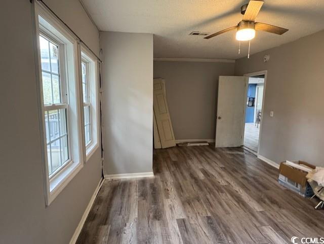 15 Mango Street Andrews, SC 29510 - Photo 26 of 26 Unfurnished bedroom with wood finished floors and ceiling fan