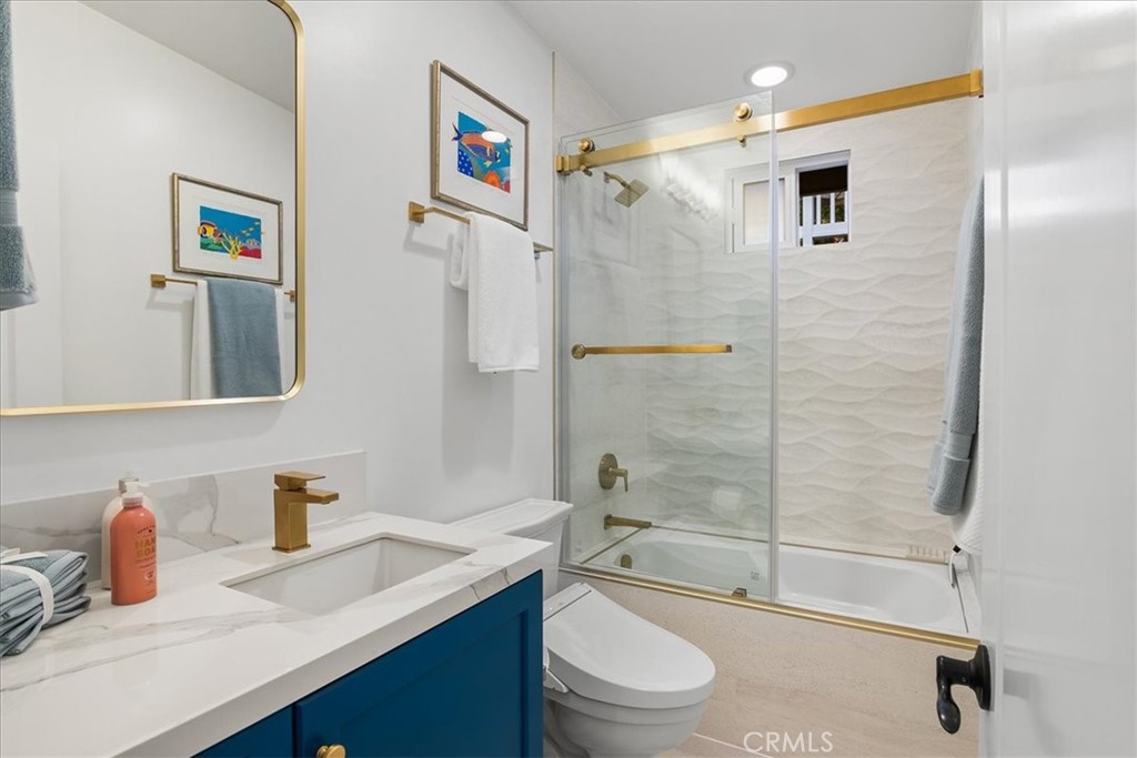 737 Griffith Way Laguna Beach, CA 92651 - Photo 19 of 25 a bathroom with a granite countertop sink toilet and shower